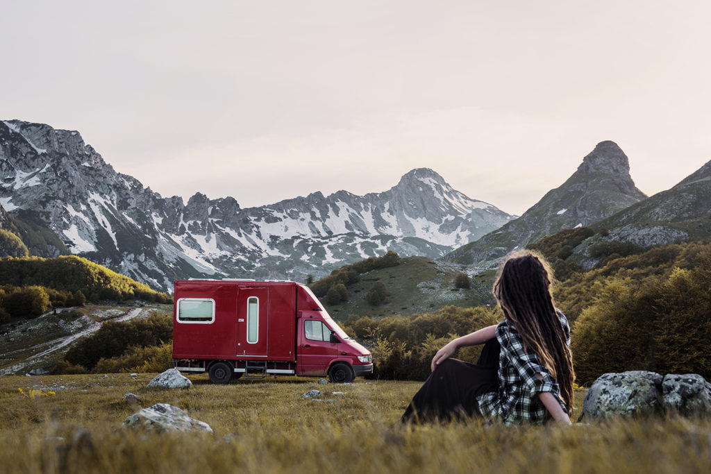 Traveler Anna Heimkreiter and her red camper called Alois.